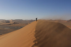 Colin walking a dune in Sossusvlei, Namibia